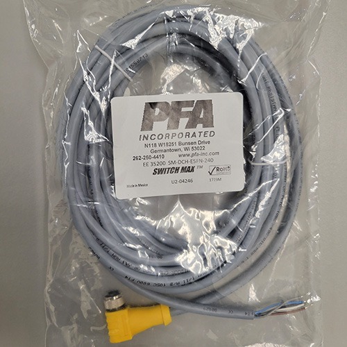 A packaged grey Ethernet cable with a yellow RJ45 connector and an attached label from PFA Incorporated, indicating it is part of the SWITCHMAX™ system.