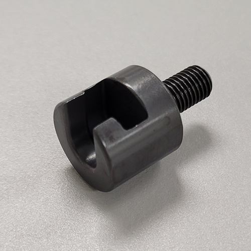 A specialized metal tool with a threaded shaft and a slotted end, designed for a mechanical application, on a grey background.