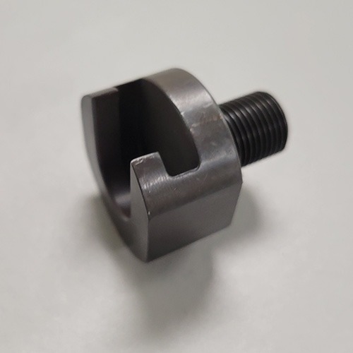 A specialized metal tool with a threaded shaft and a slotted end, designed for a mechanical application, on a grey background.