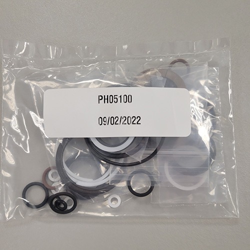 Assorted mechanical O-rings and seals contained in a plastic bag, labeled with part number 'PH05100' and a date of '09/02/2022'.