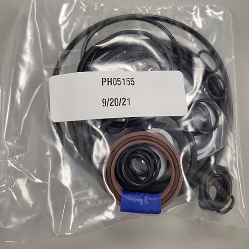 A mix of mechanical O-rings and seals in a clear plastic package, with part number 'PH05155' and a date '9/20/21'.