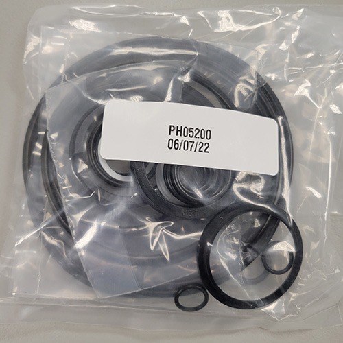 A set of mechanical O-rings and seals in a see-through plastic bag, with part number 'PH05200' and a date of '06/07/22'.