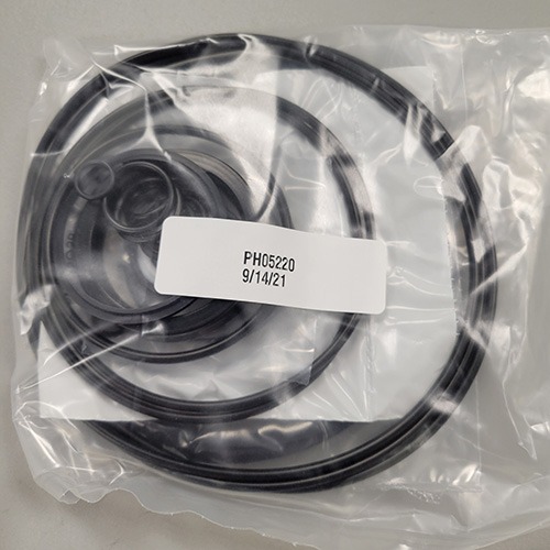 Assortment of O-rings and seals in a transparent plastic bag, marked with part number 'PH05220' and date '9/14/21'