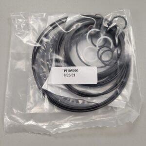 Assorted mechanical O-rings and seals in a clear plastic bag, with a label showing part number 'PH05090' and a date '8/23/21'