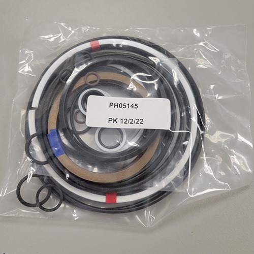 A variety of mechanical O-rings and seals packaged in a clear plastic bag, labeled with part number 'PH05145' and a packing date of '12/2/22'.